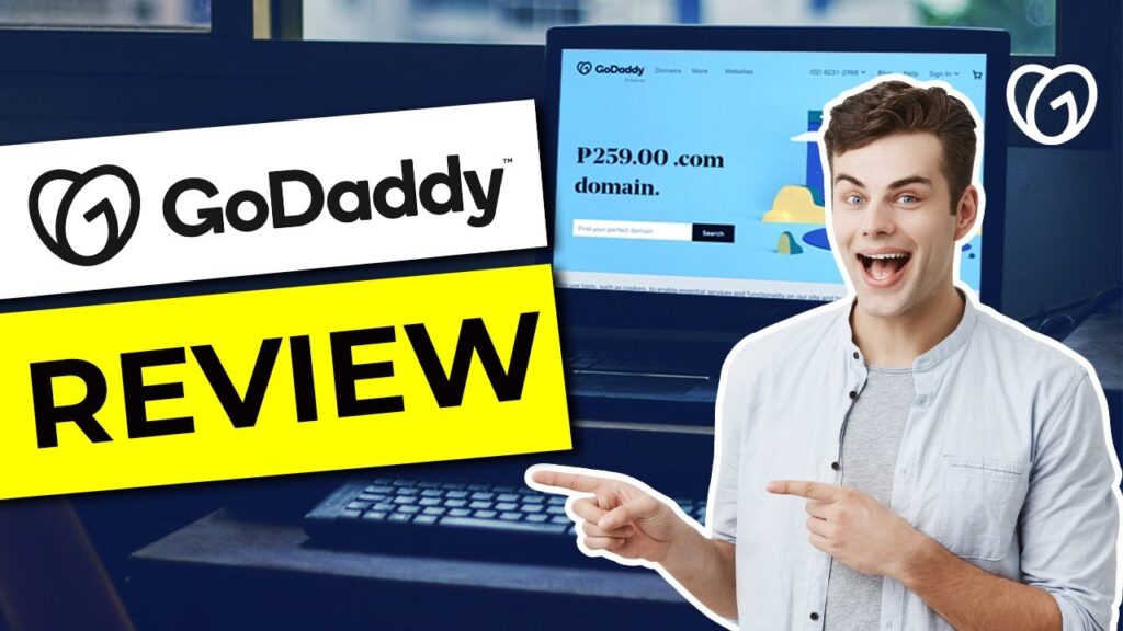 Smiling man pointing at GoDaddy review banner.